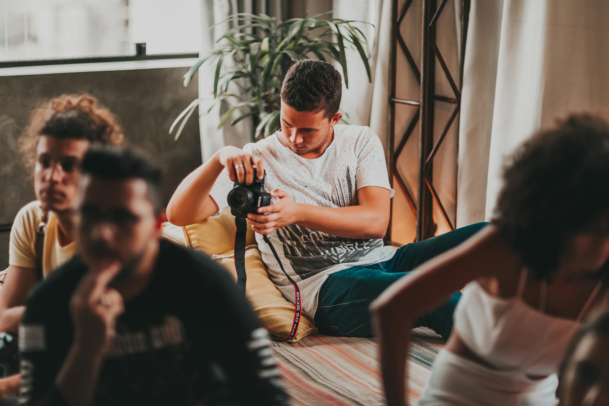 concentrated young man taking photos on professional